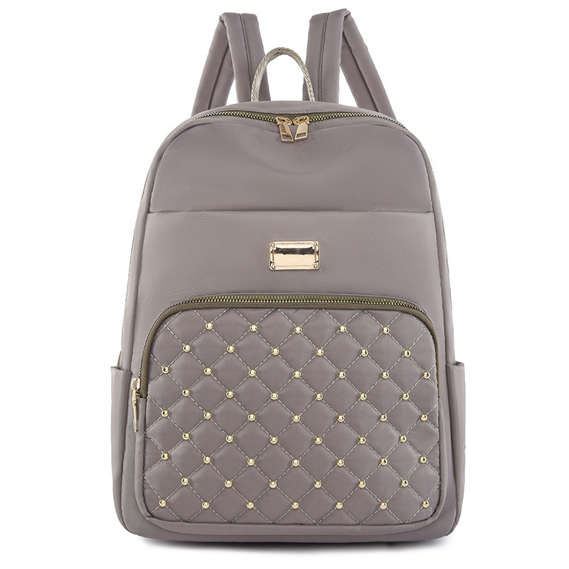 2023 nueva mochila de tela Oxford para mujer casual moda rombo remache mochila ligera mochila de viaje urbano