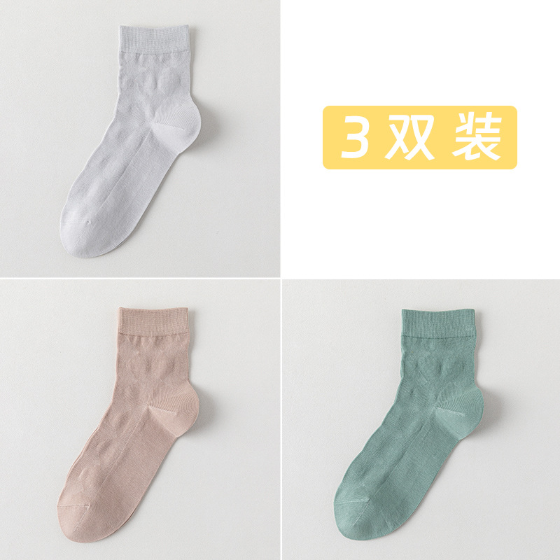 Calcetines de algodón de color sólido para hombres primavera y otoño medio tubo de diamante sin hueso transpirable absorción de sudor embalaje independiente calcetines de hombre al por mayor