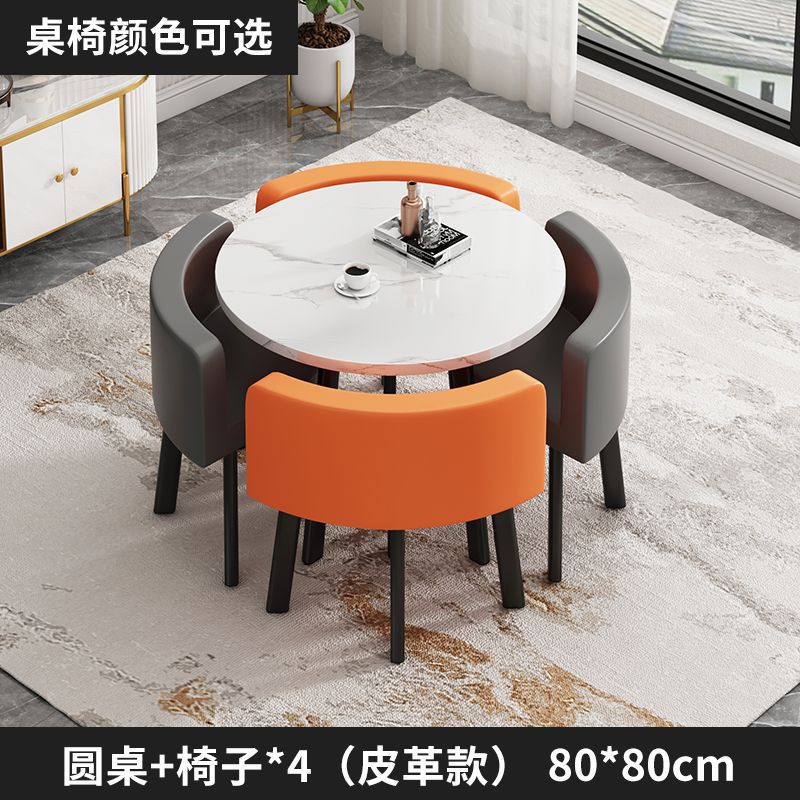 White round table + 2 orange and 2 gray leather chairs