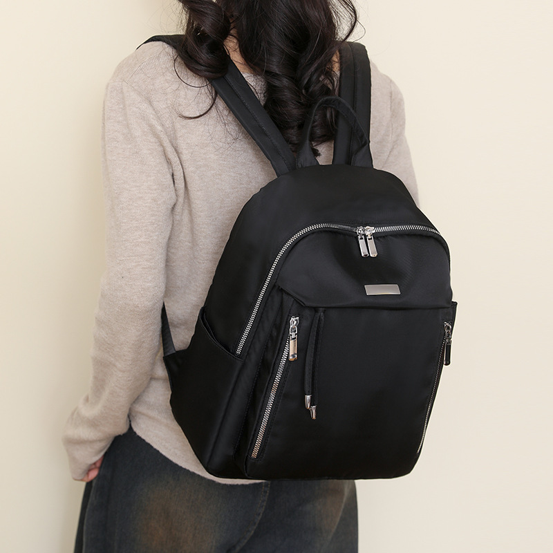 Mochila de sentido avanzado para mujer 2024 nueva mochila de computadora ligera de viaje de moda simple y versátil para estudiantes universitarios