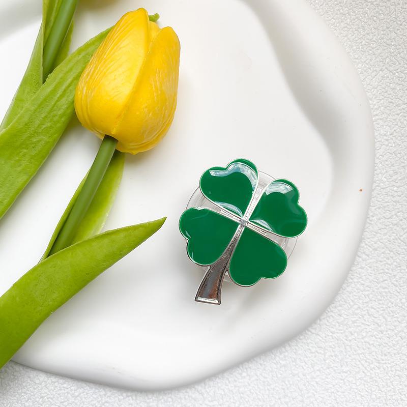 Instagram phone airbag with electroplated four leaf clover alloy sunflower desktop lazy support bracket on the back_voghion.com