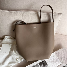 TheRow高级感水桶包时尚荔枝纹大容量通勤托特包单肩手提真皮包女