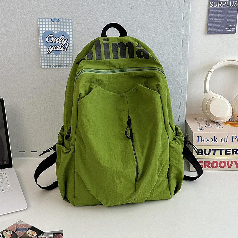 Mochila escolar 2025 nicho ligero y anti-salpicaduras de agua estudiantes de secundaria hombres y mujeres deportes de gran capacidad al aire libre mochila de viaje