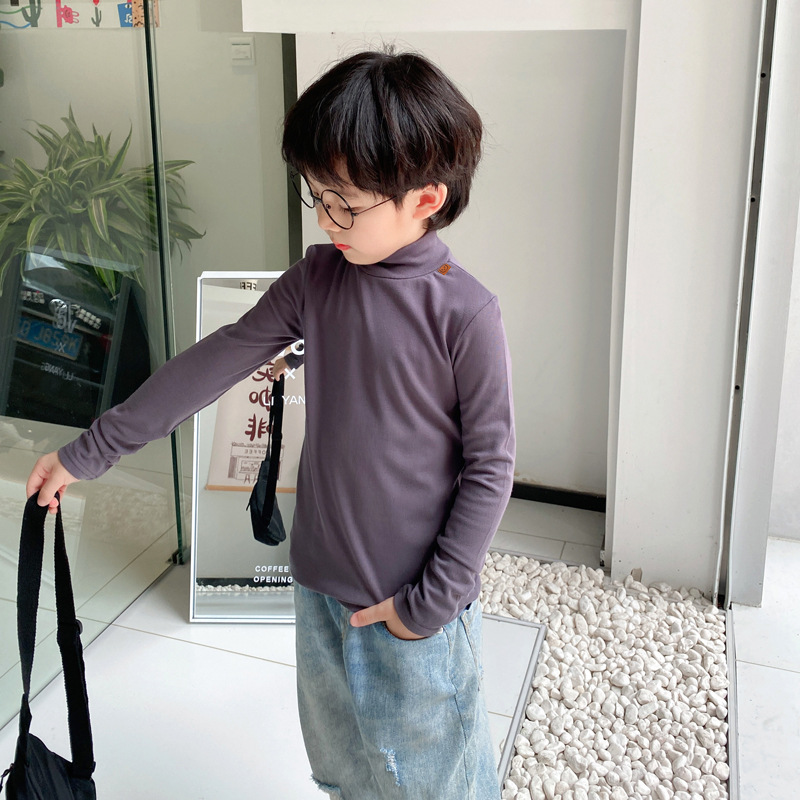 Ropa de otoño e invierno para niños nuevo estilo coreano color sólido camiseta de los muchachos medio cuello alto camisa de fondo para niñas engrosada bebé manga larga superior