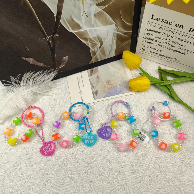 Wholesale cross-border new candy-colored square bead phone chain with acrylic heart pendant keychain bag charm Wholesale cross-border new candy-colored square bead phone chain with acrylic heart pendant keychain bag charm