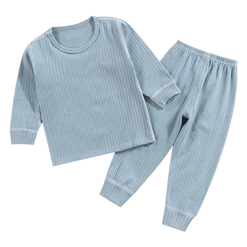 Camisa de fondo sin hueso para niños primavera y otoño ropa de otoño para niños medianos y grandes pantalones largos bebé ropa de hogar simple niños y niñas pijamas de cuello redondo