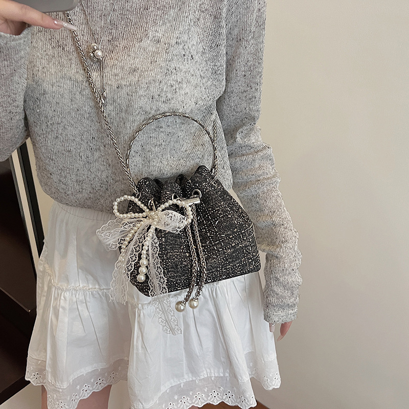 Verano popular taladro caliente bolso de cubo de mano mujer 2025 nuevo estilo coreano denim casual mochila para trabajar