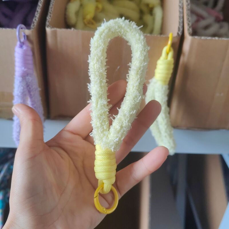 新しい色の手編みの蝶結びのキーホルダーの紐の学生のカメラのかわいいカップルのリュックサックの飾りの紐|undefined