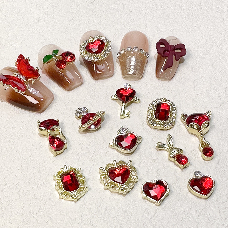 2023 Nueva joyería de uñas Año nuevo rojo aleación conejo rojo mariposa de cristal pintura en aerosol arco accesorios de diamantes de uñas