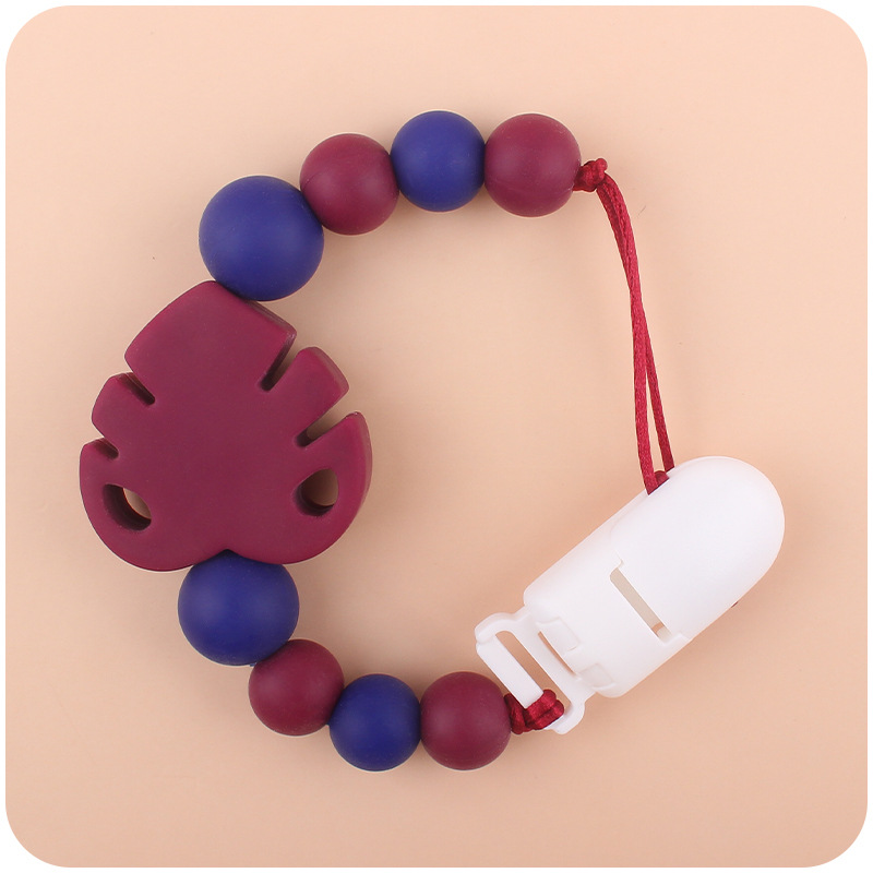 Suministros para bebés chupete cadena creativa bebé dibujos animados hojas silicona mordedura cadena anti-gota molar Nuevo