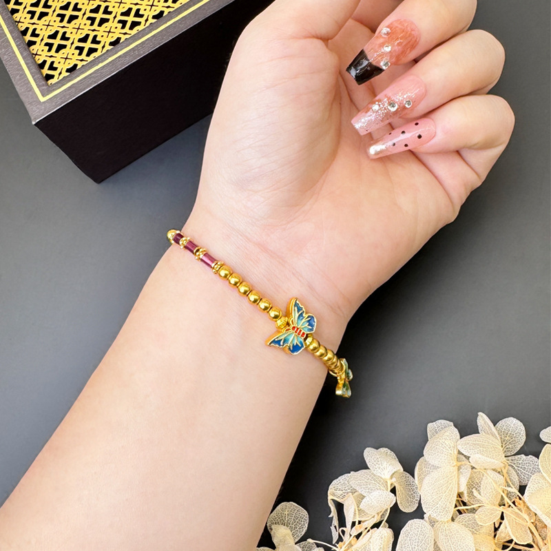 Brazalete de mariposa de esmalte de oro de arena vietnamita no se desvanece durante mucho tiempo. nuevo estilo chino retro nicho sensación de diseño de joyería de cuentas