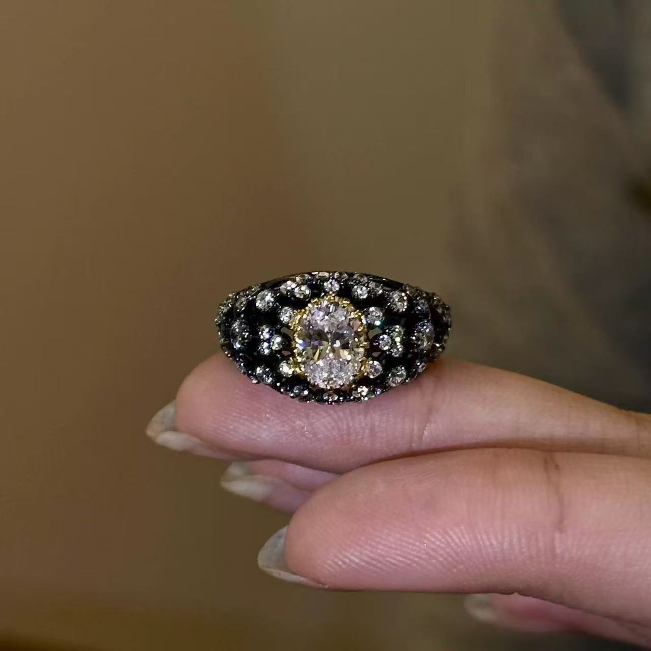 Black gold oval ring