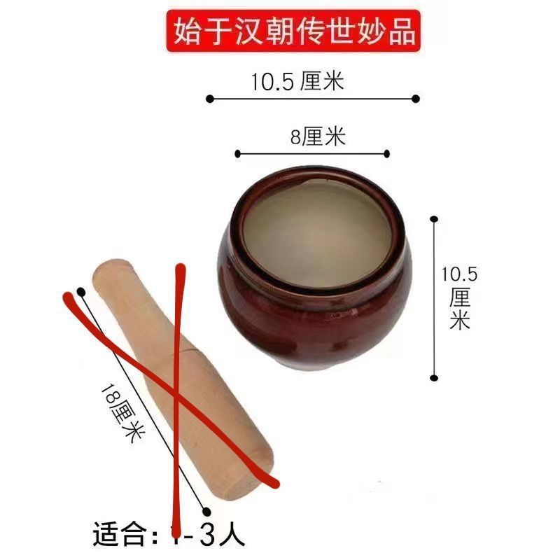 旧式の石臼でにんにくのハンマーをいじっています。|undefined