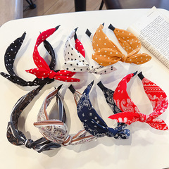 新商品の韓国のカチューシャのレトロな香港風の蝶結びのウサギの耳の甘い布芸のシンプルで広いエッジの波の点のカチューシャの女性