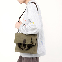 帆布包男包挎包休闲男士包包快递男包时尚背包大容量斜挎单肩包