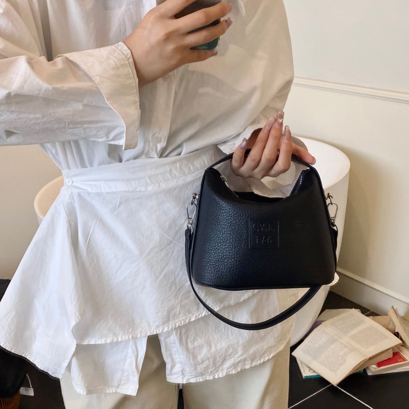 Bolso de moda coreano 2025 verano nuevo bolso femenino retro litchi patrón bandolera simple letra bandolera