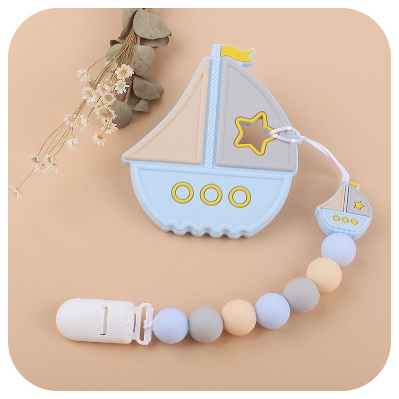 El Comercio exterior nuevo bebé suministros Cadena de chupete de silicona vela dientes de juguete de silicona de dibujos animados Cadena de molienda