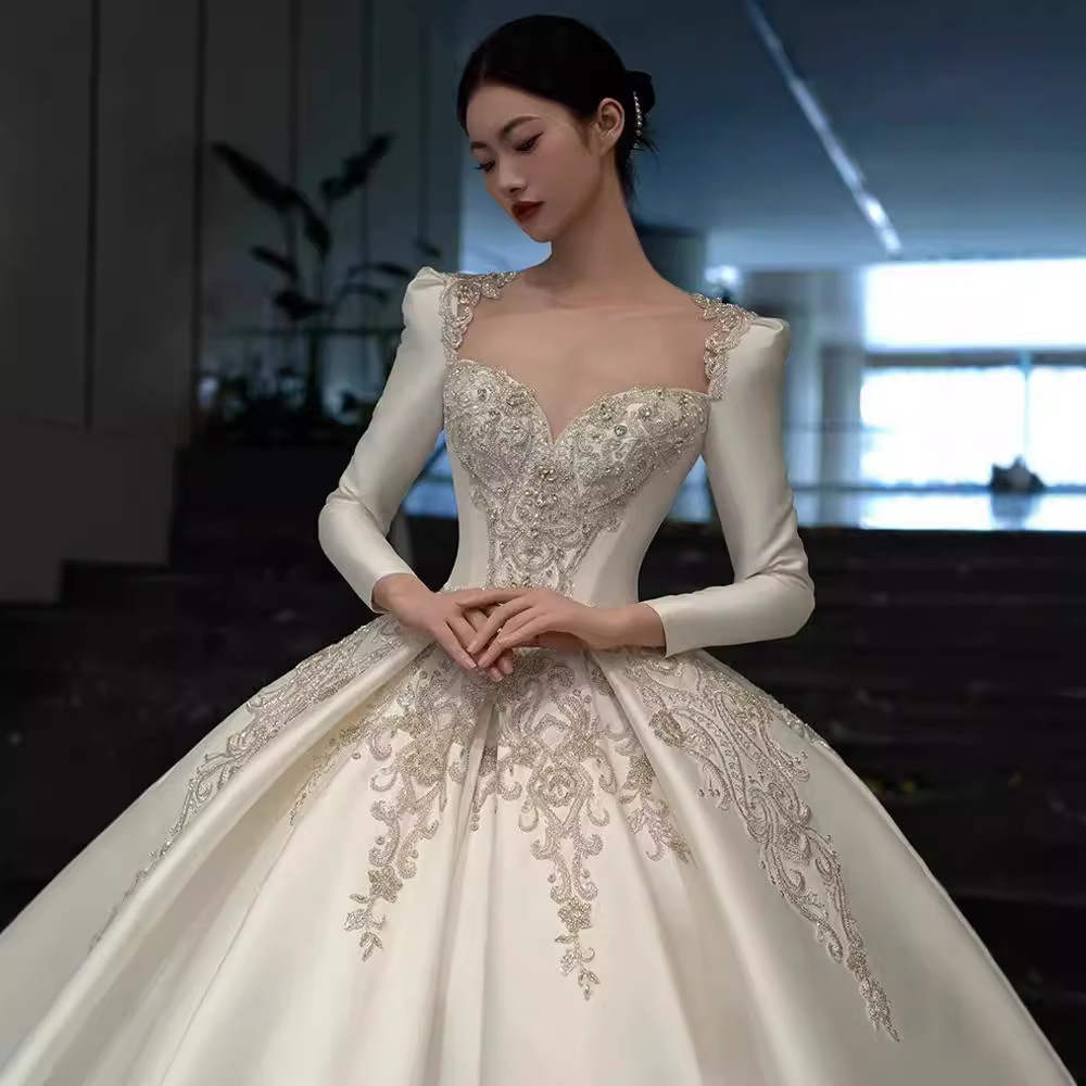 Vestido de novia de satén texturizado de alta gama, estilo invierno 2026, de manga larga, estilo princesa, con cola, de lujo, estilo francés.