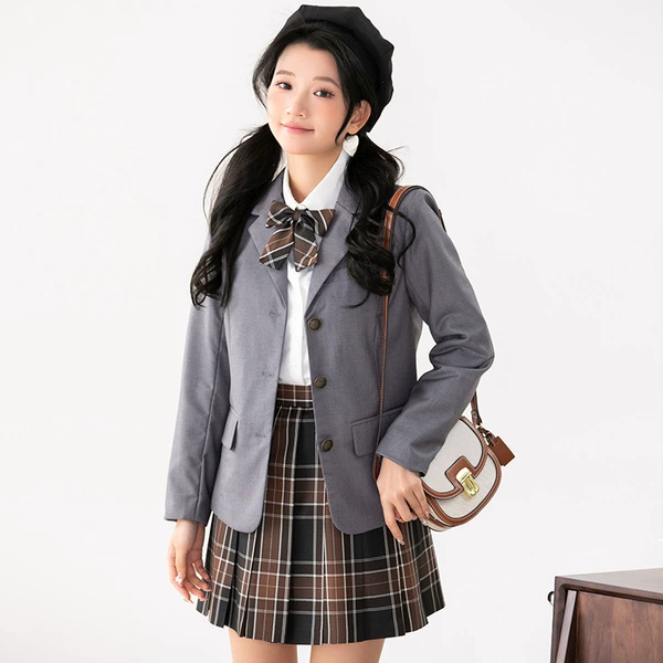 Classic suit jacket, shirt, skirt, bow tie, badge