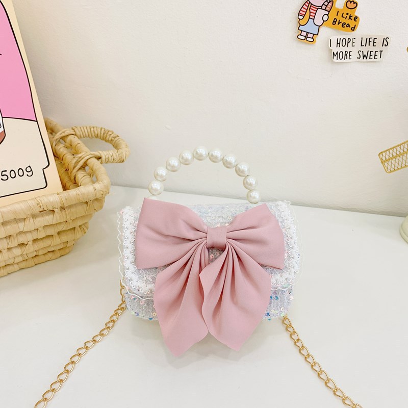 Otoño y invierno coreano arco camellia bolsas de niños de encaje de mano perlas bolsas mochilas para niñas de jardín de infantes