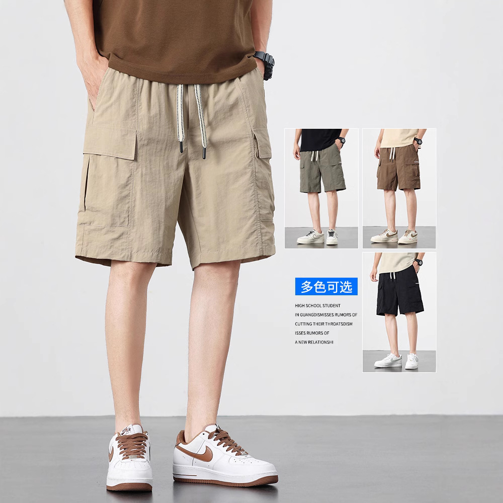 アメリカ式の大きいサイズのショートパンツの男性の夏の薄いタイプの新型の工装の5分のズボンの男性のタイプの氷の糸の速乾のカジュアルな中のズボン