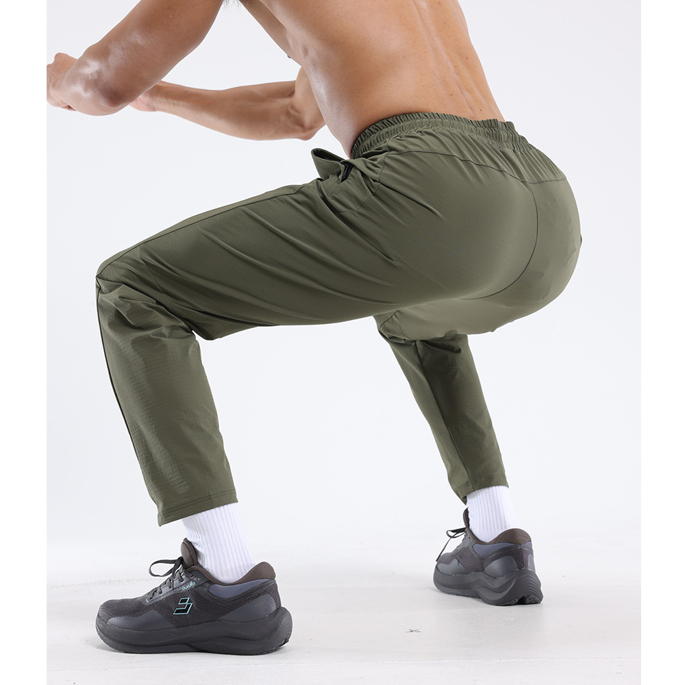 Dijia Running Sports Pantalones de entrenamiento para hombres, pantalones de tejido transpirables y rápidos, pantalones casuales impermeables y húmedos.