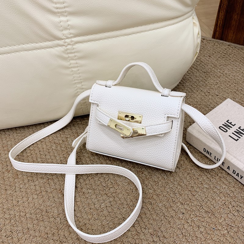 Bolso de hombro para niños y niñas de estilo coreano mini bolso de mensajero para padres e hijos de color sólido simple nuevo monedero con cerradura para niños