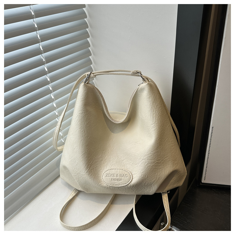 The 2024 new pleated tote bag is a large-capacity casual and fashionable backpack for women, featuring multi-functional texture and a single-shoulder crossbody bag undefined