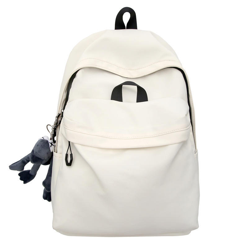 Las chicas japonesas de bolsos de lona son antiguas, impermeables, de color sólido, bolsos de nylon, Campus simple y versátil mochilas escolares para hombres de moda.