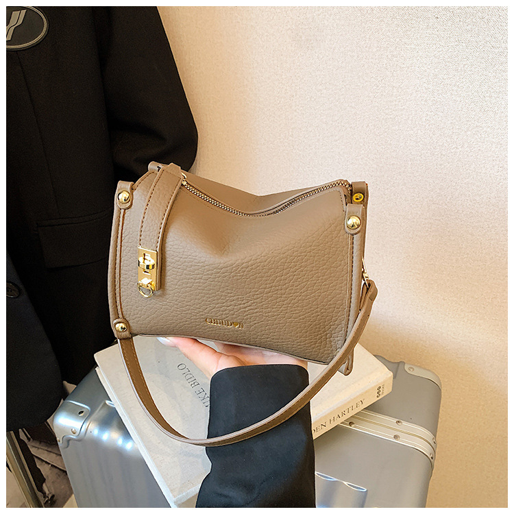 Bolsos retro retro de alta calidad para mujeres 2026 nueva textura lichi bolso pequeño estilo coreano simple mochila de hombro
