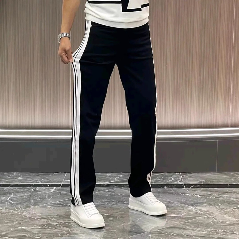 Otoño nuevos pantalones vaqueros elásticos de moda para hombres Pantalones rectos sueltos de cinta lateral juvenil pantalones de pierna ancha lavados versátiles