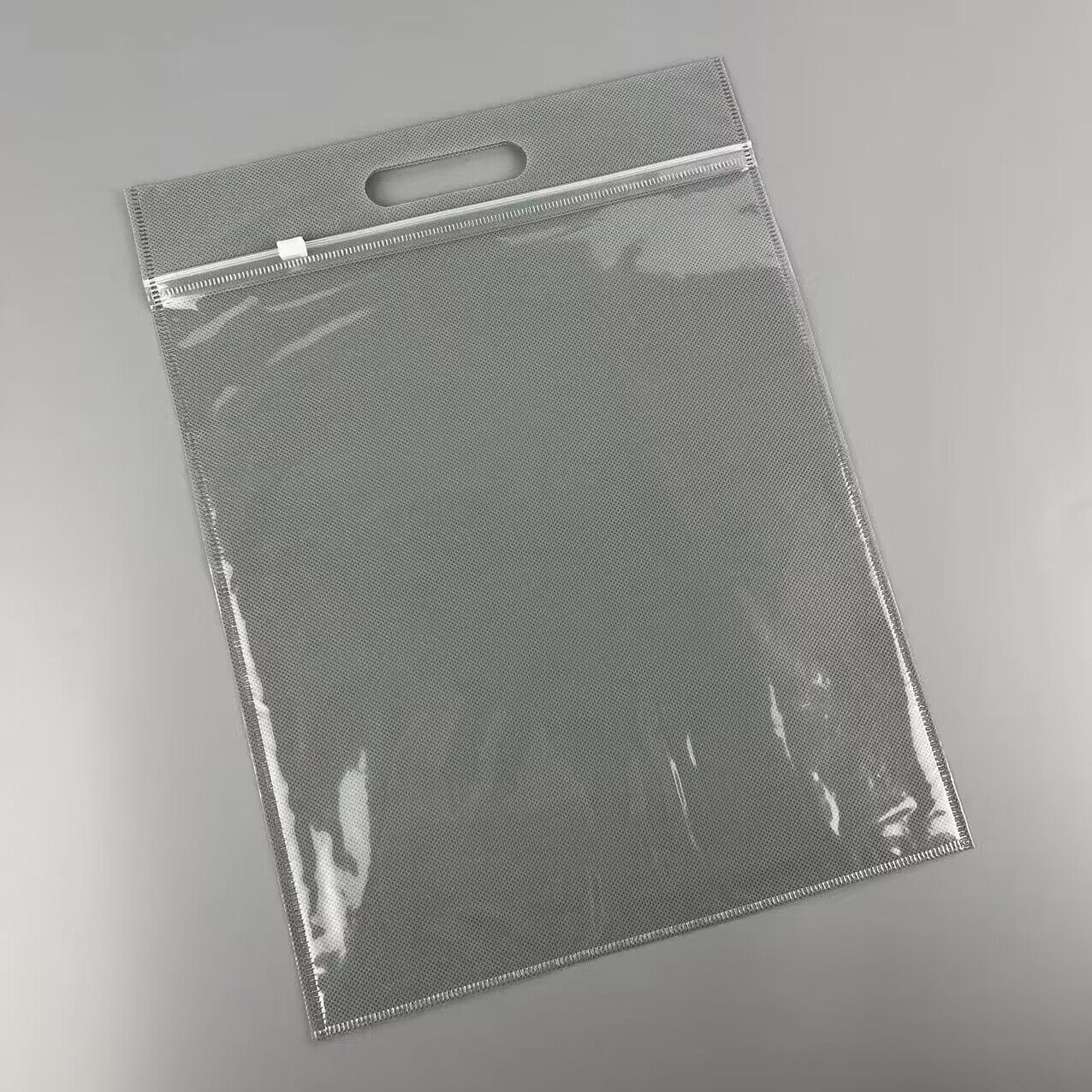 En stock no tejido cremallera bolsa bolso ropa bolsa de embalaje al por mayor ziplock bolsa no tejida transparente cremallera bolsa