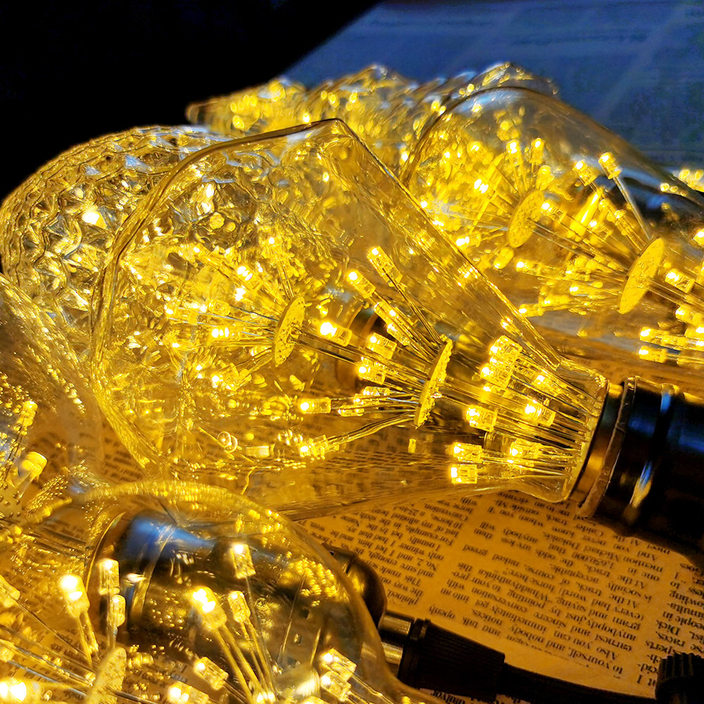 Bombilla de Edison transfronteriza estrellado luz LED E27 tornillo iluminación retro luz cálida bombilla roja neta