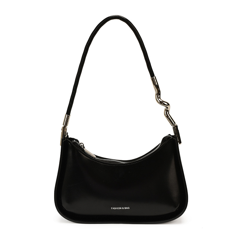 Nicho de diseño bolso de brazo para mujeres 2026 comercio exterior nueva moda alta sensación de viaje simple bolso de media luna de hombro