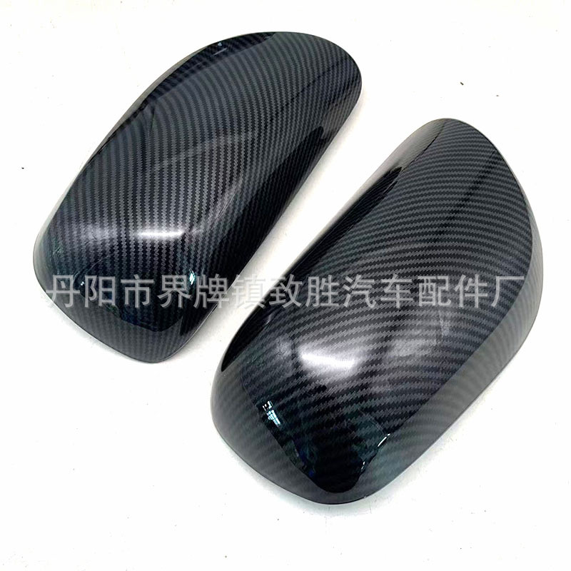 Adecuado para Toyota Yaris 06-11 espejo retrovisor Shell Yaris espejo retrovisor trasero Shell negro brillante patrón de carbono