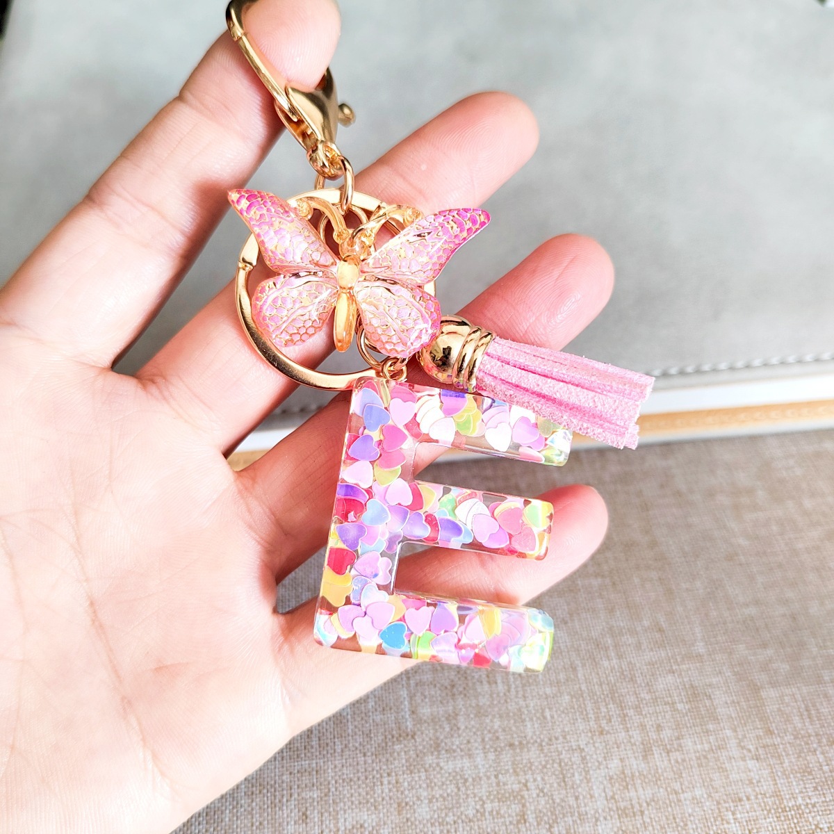En stock transfronterizo resina letras inglesas epoxi joyería europea y americana popular mariposa adornos amor lentejuelas llavero