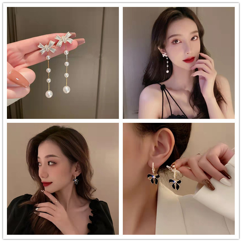 Long fashionable elegant retro earrings with bow pearl