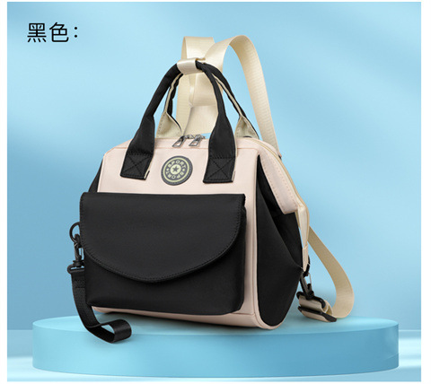 The Mommy bag is small and cute. It has a detachable front pocket and is a multi-functional baby bag. It is waterproof, lightweight, and has a crossbody design. It can be used to carry milk bags undefined