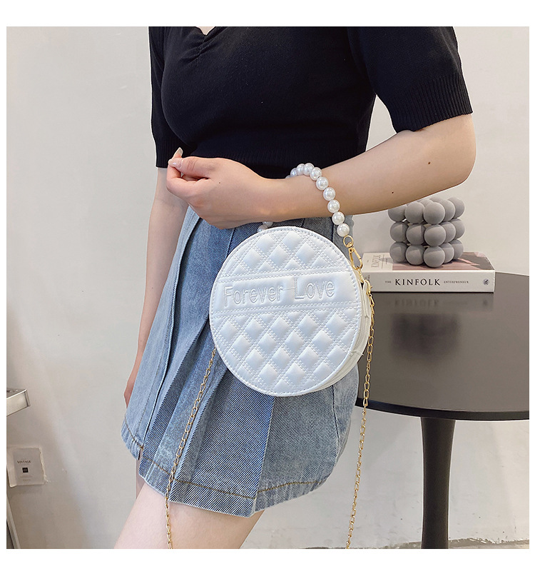 Fashion Solid Color Embossed Pearl Handle Small Round Bag display picture 1