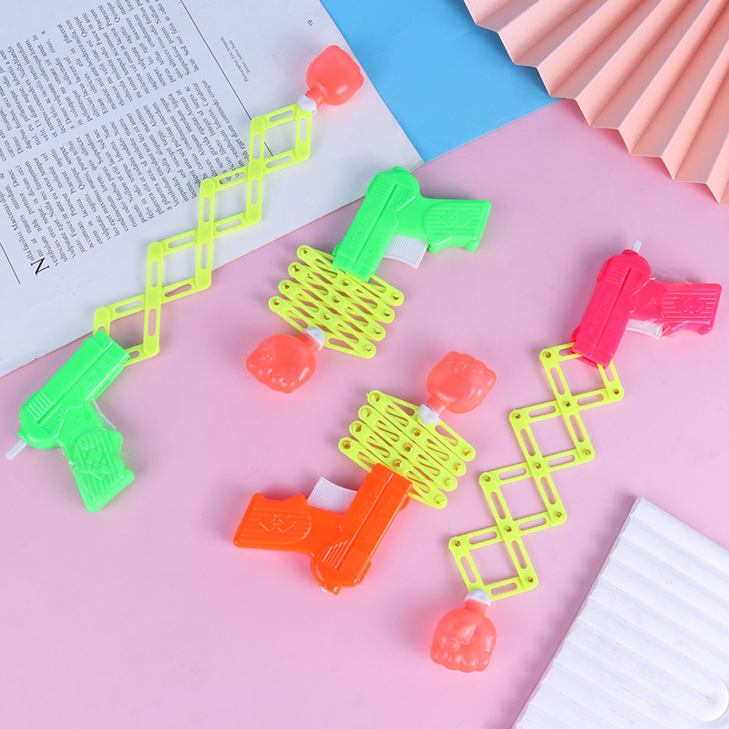 Magia de puño retráctil pistola elástica de resorte juguetes para niños después de los 80 nostálgicos y divertidos juguetes pequeños al por mayor