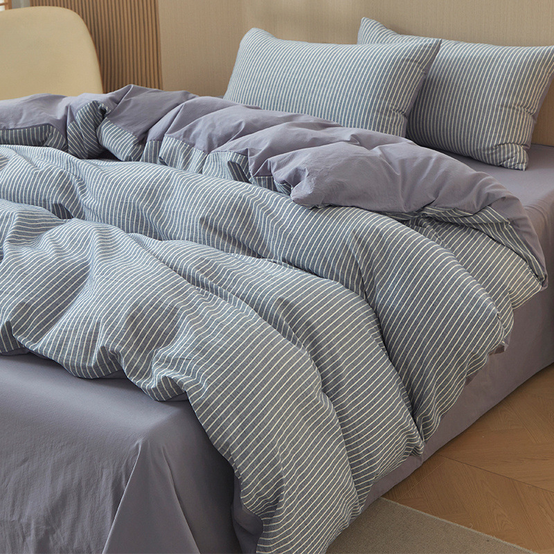 Nuevo traje de cama de algodón lavado de algodón de cuatro piezas de algodón 2025 nuevo traje de dormitorio de funda de edredón de sábana simple de tres piezas