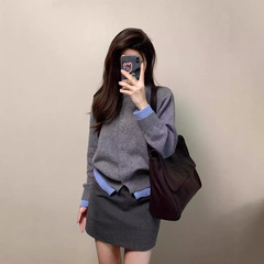 韓国版の偽の2つの灰色の柔らかいモチモチのニットの女性の春秋の高級感の気質のカジュアルなコンビネーションのボタンのカーディガンのコート