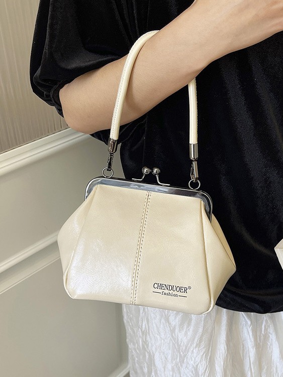 Bolso de conchas de moda para mujeres 2026 comercio exterior nuevo bolso coreano de abrazadera alta sensación retro versátil mochila