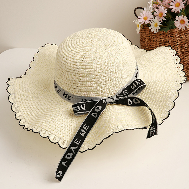 Sombrero de paja de viaje de verano flor sombrero de playa protección solar sombrero de sol ala grande paja tejida a mano arco sombrero de sol