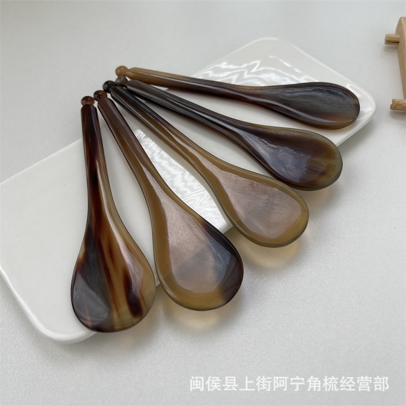 Horn Guasha and Acupoint Massage Stick Set Round Paddle Facial Eye Beauty Tool Body Meridian Wand in use