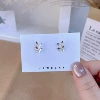 Silver butterflies on the left and right pair
