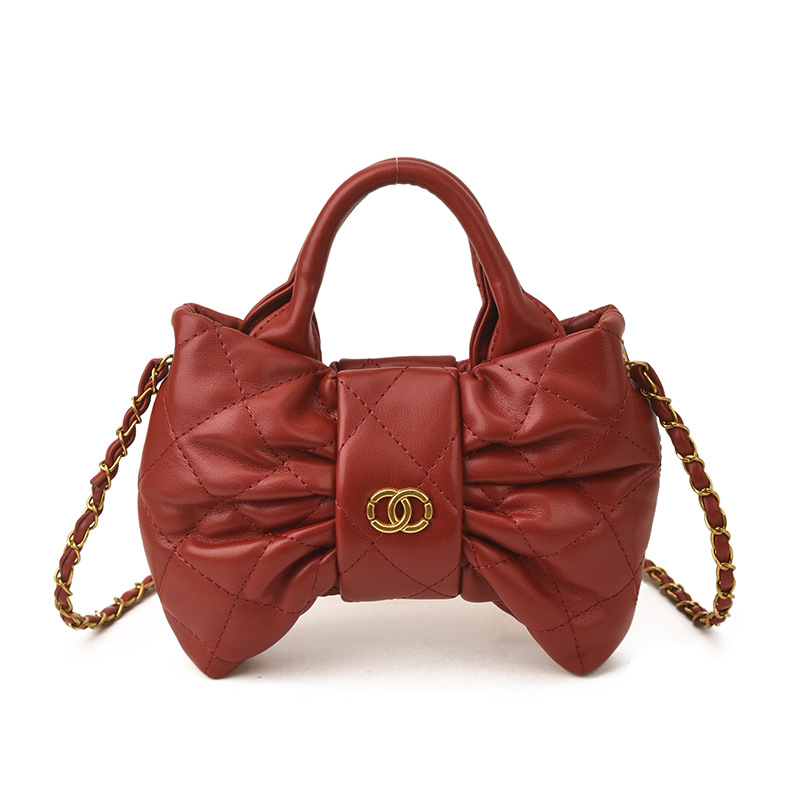 Bolsa de mano de chicas arco dulce cadena de diamante pliegue bolso de hombro 2026 nuevo bolso infantil transfronterizo