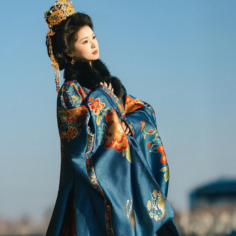 A noble lady of the Ming Dynasty, wearing a Ming-style embroidered Hanfu with intricate gold thread work, a mandarin collar, and a long robe with a front closure, posing for a photo shoot at the Forbidden City A noble lady of the Ming Dynasty, wearing a Ming-style embroidered Hanfu with intricate gold thread work, a mandarin collar, and a long robe with a front closure, posing for a photo shoot at the Forbidden City