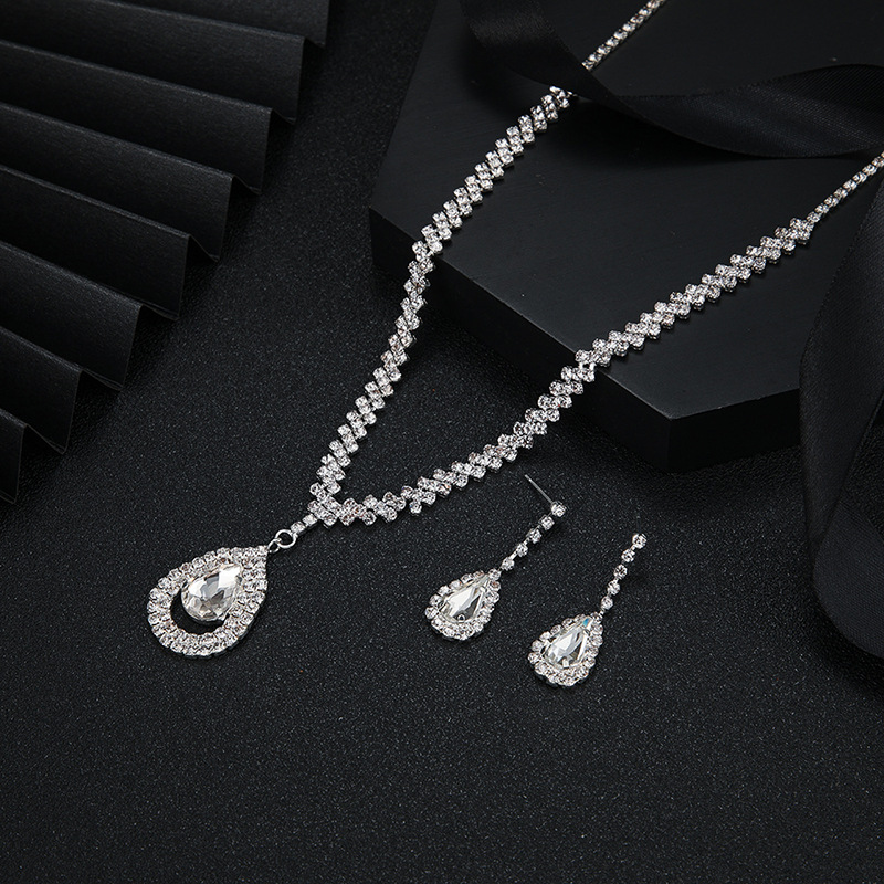silver necklace and earrings
