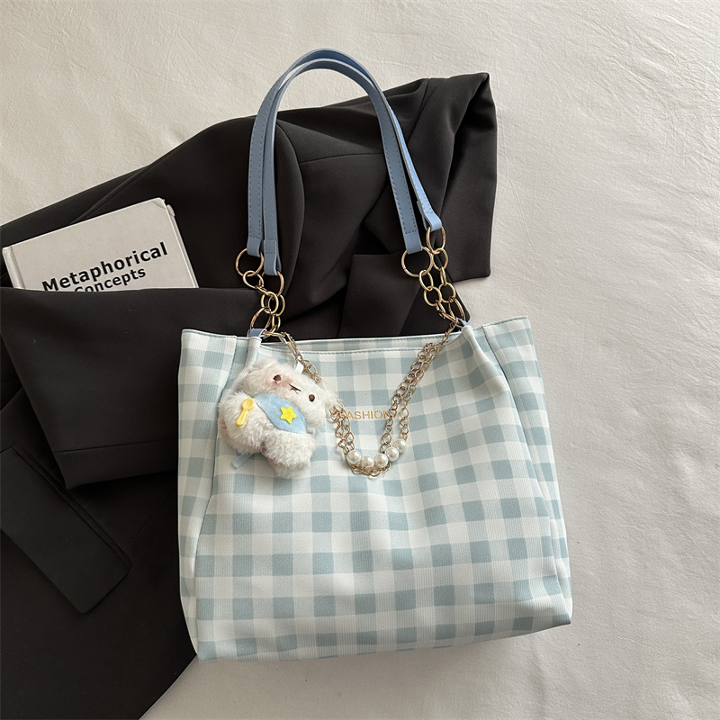 Bolsa de alto valor reticular para mujeres 2026 primavera y verano nuevo paquete de viaje de hombro universal bolso de nicho en línea bolsa de mujer